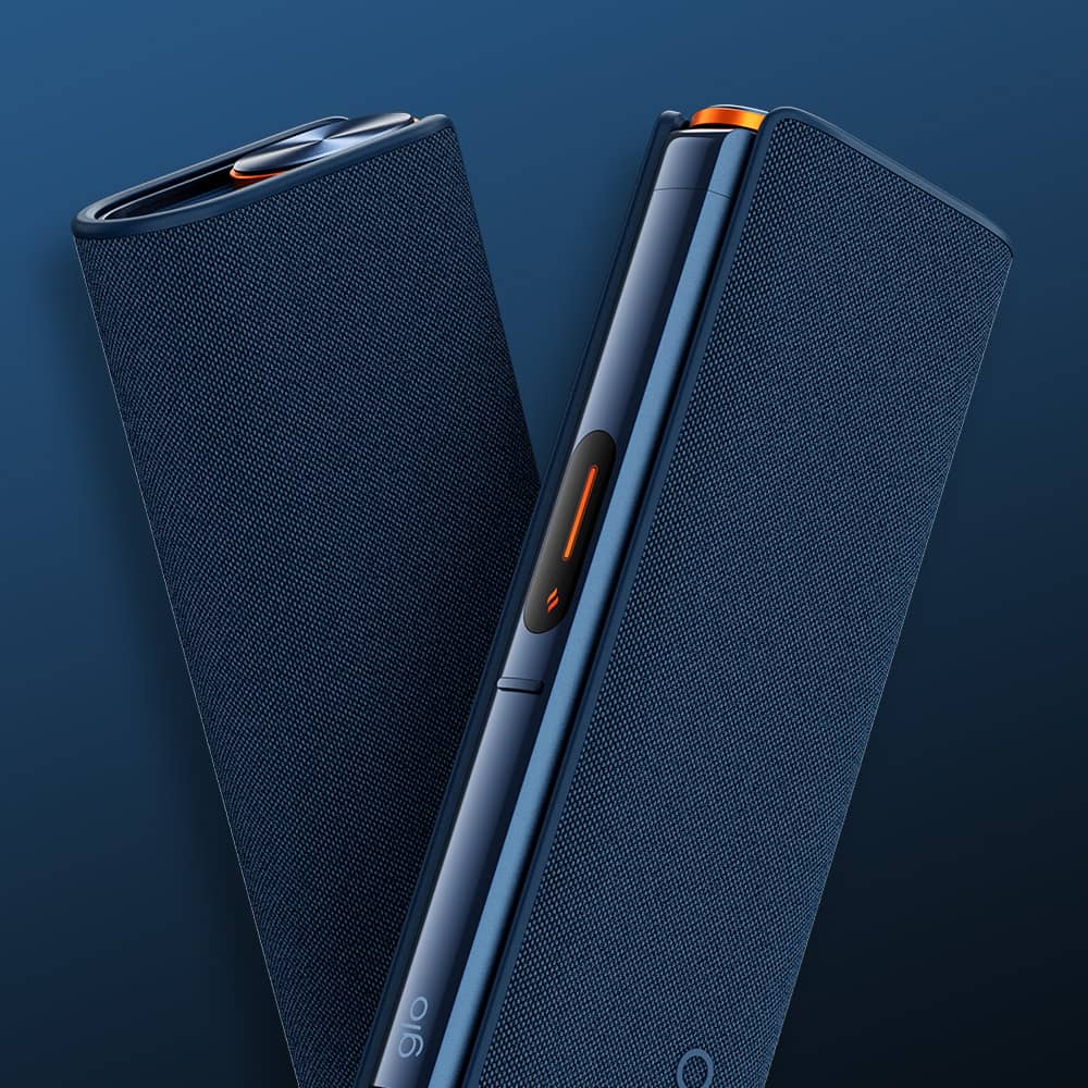 Two sleek, modern, dark blue electronic devices with textured surfaces are shown against a blue background. One is partially open, revealing a smooth hinge and orange accent.