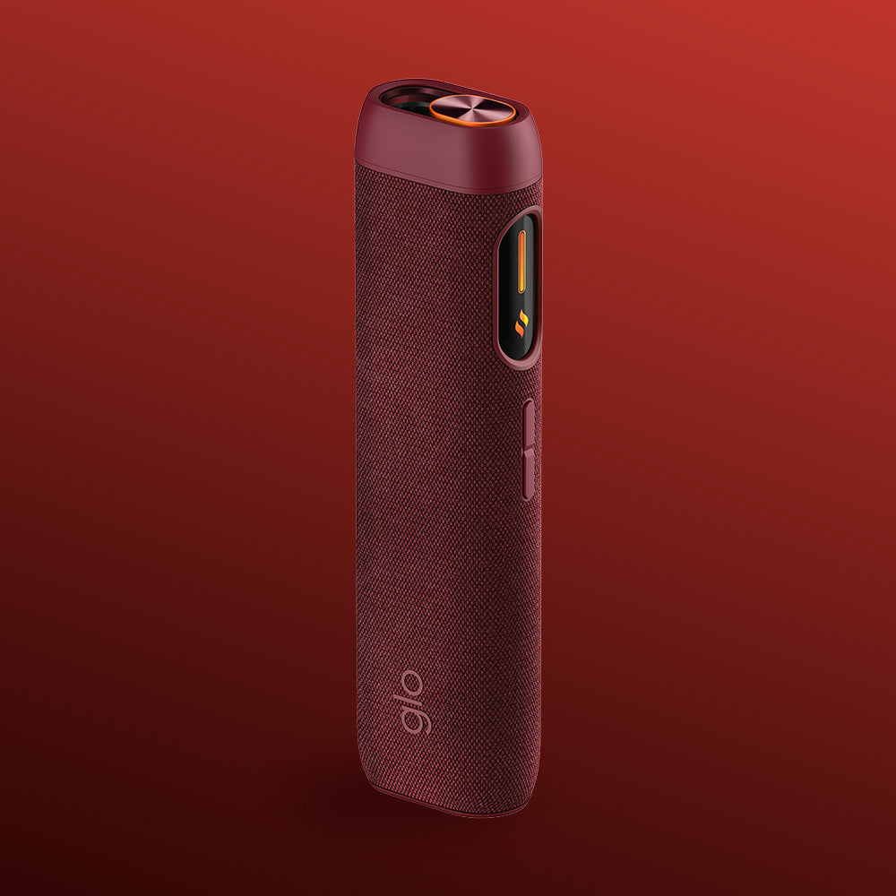 The glo™ HILO Sleeve is a sleek, maroon portable electronic accessory featuring a premium textured fabric cover, rounded edges, and a side indicator, shown on a red gradient background to stylishly protect your device.