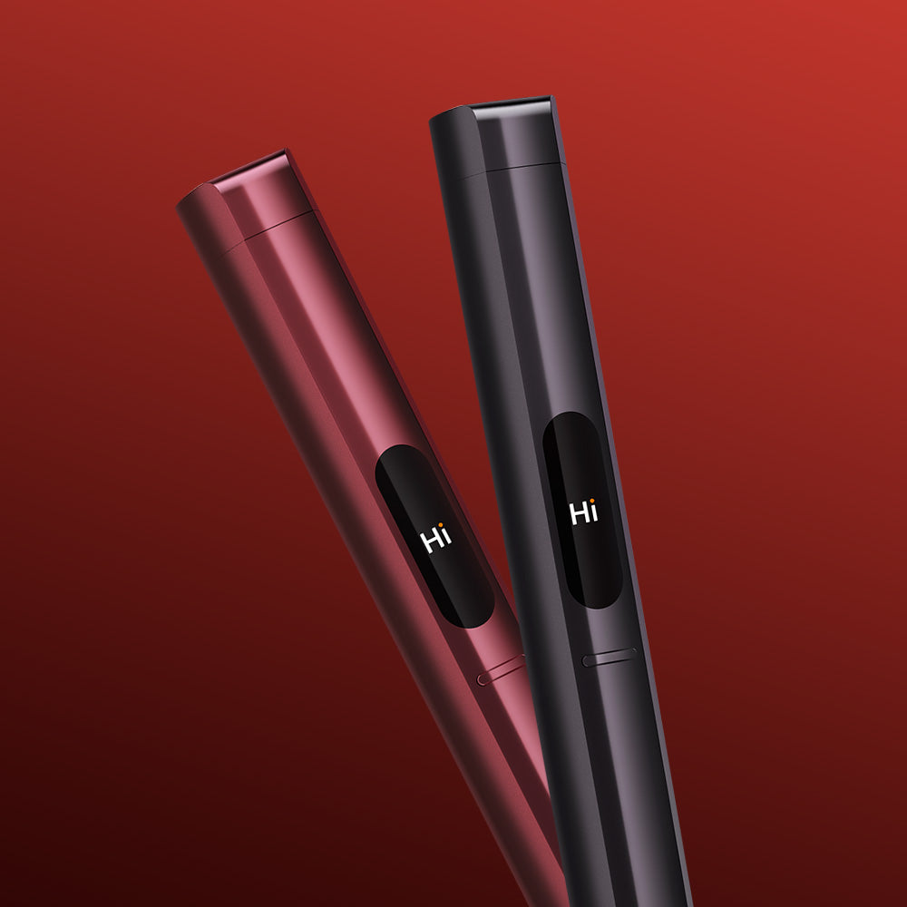 Two pen-shaped glo™ HILO Plus Replacement Pens, one red and one black, stand upright on a gradient red background. Both display “Hi” in white on their black screens, highlighting the option to customise or choose a replacement pen.