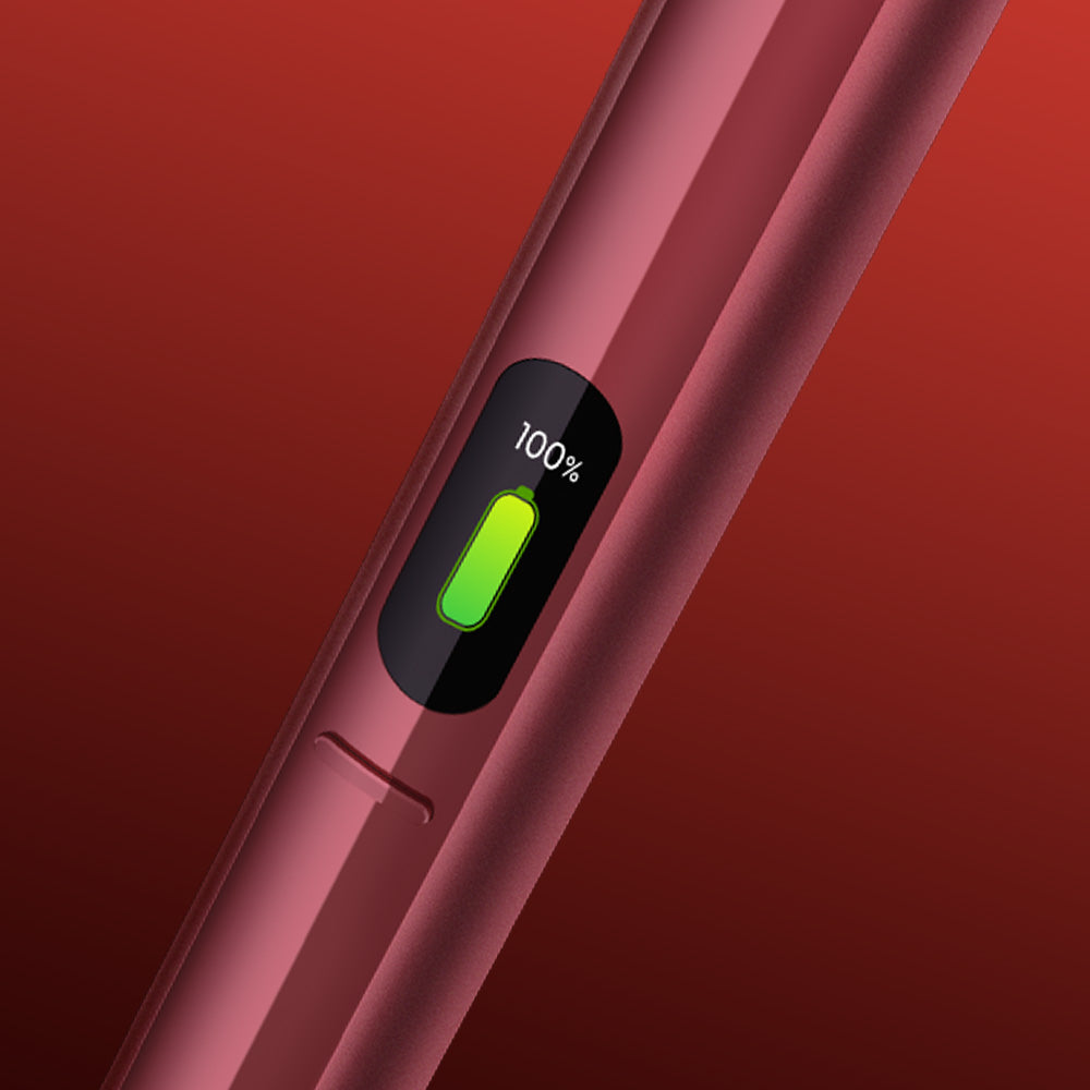 A close-up of a gleaming glo™ HILO Plus Charging Dock with a digital screen showing 100% and a green battery icon, signaling full charge and readiness for use, set against a red gradient background—ideal as your backup charger.