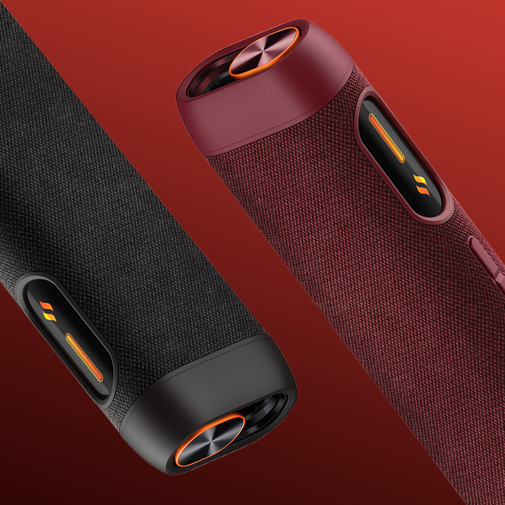 Two glo™ HILO Sleeve wireless speakers, in black and dark red, float against a red gradient background. Both have premium fabric covers with orange accents and side control buttons.