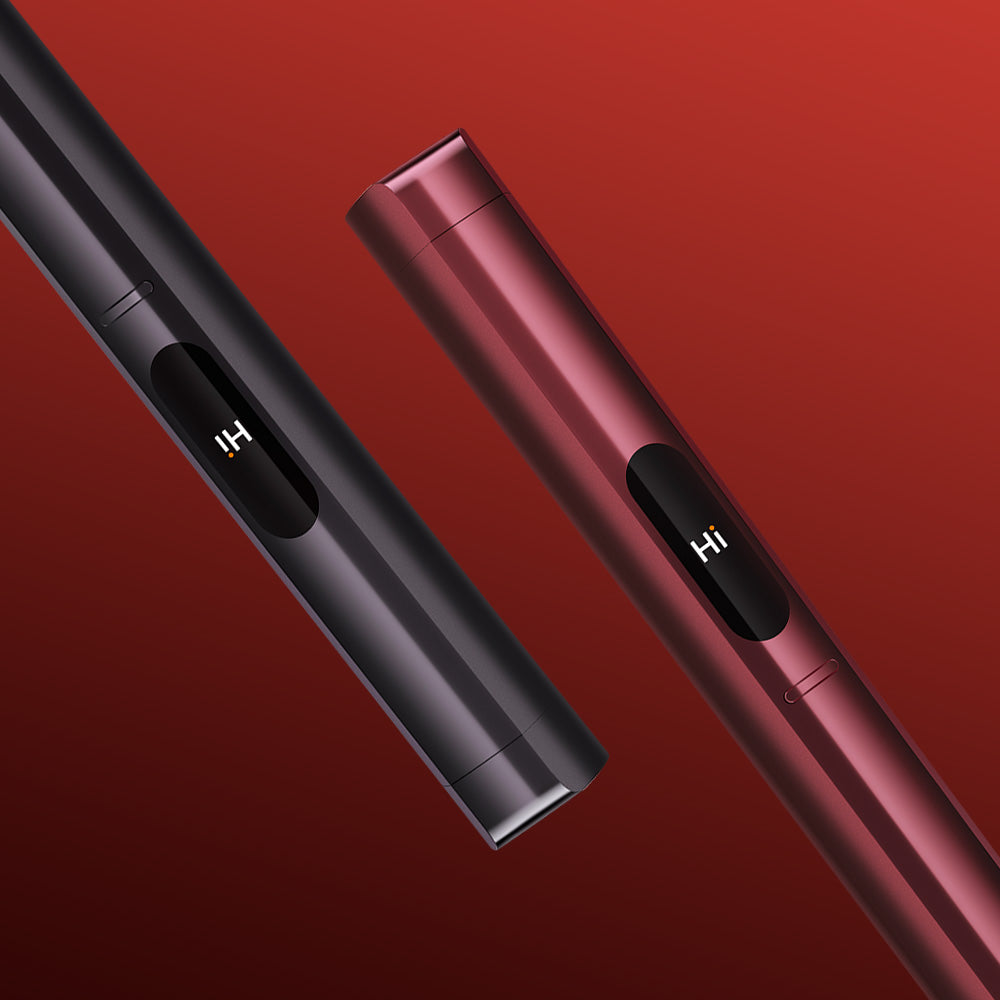 Two sleek glo™ HILO Plus Replacement Pens—one black, one red—are displayed diagonally on a gradient red background. Each pen's screen shows "Hi," showcasing how you can personalise your glo™ HILO Plus Replacement Pen to match your style.