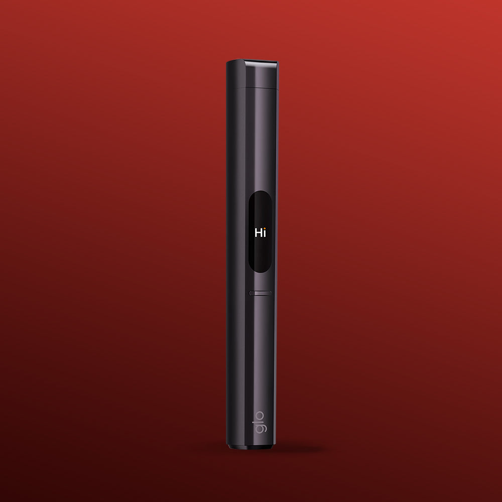 A sleek, black glo™ HILO Plus Replacement Pen with a compact screen displaying "Hi" stands upright against a red gradient backdrop. The word "glo" near its base highlights its modern design and customizable HILO Plus options.