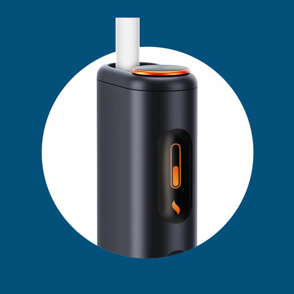 Close-up of a sleek, black electronic device with an orange button and a white cylindrical stick inserted at the top, set against a blue background with a white circular frame.